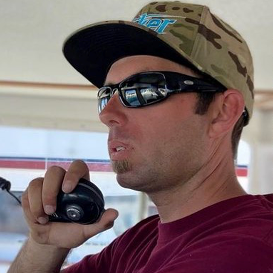 Young male boat captain wearing Sea Striker Thresher sunglasses