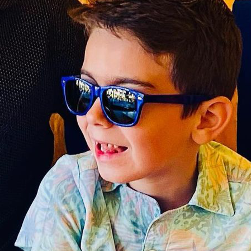 Boy wearing Just A Shade Smaller Whoop sunglasses
