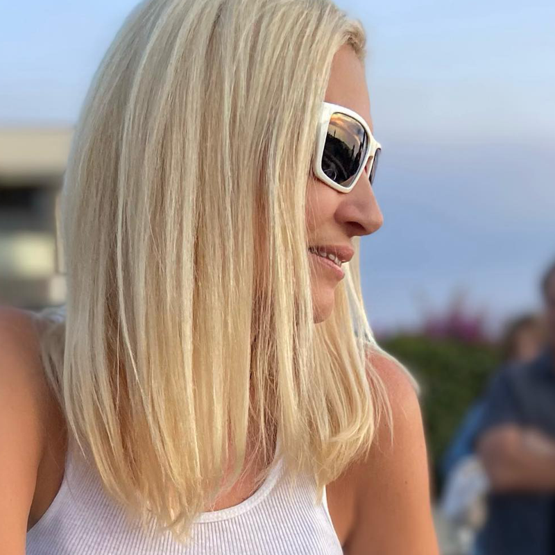Woman wearing Top Deck Ace premium polarized sunglasses