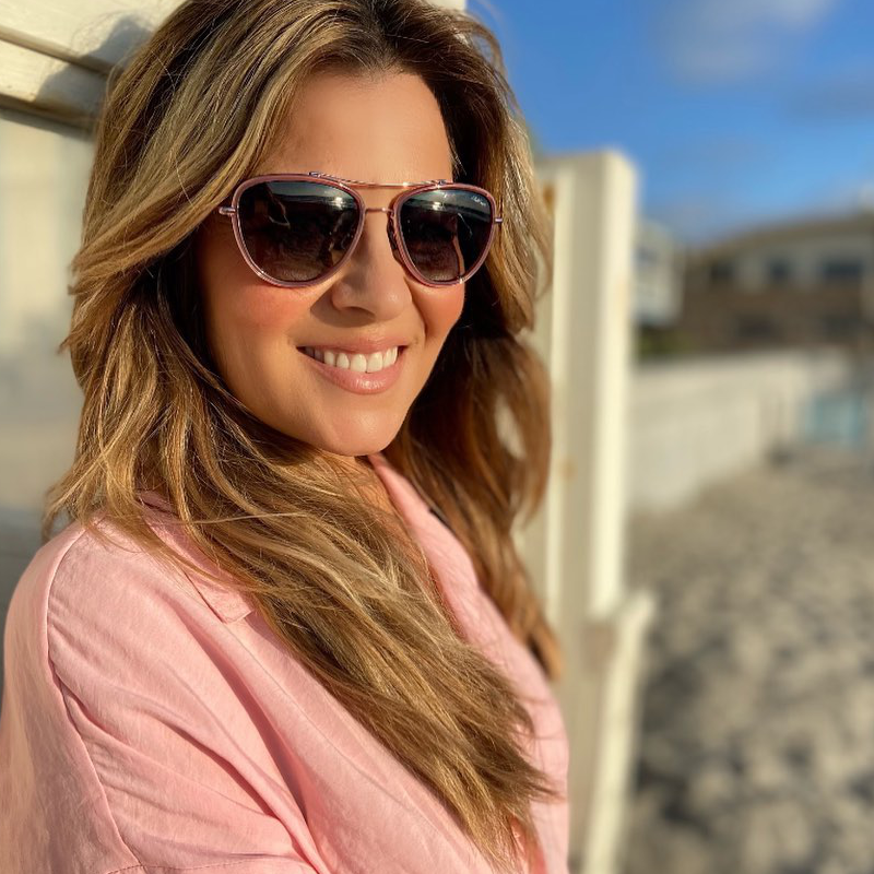 Model wearing Red Carpet Coral polarized pink aviator sunglasses