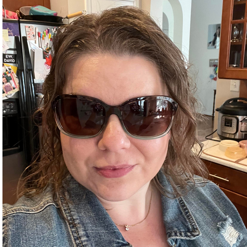 Woman wearing jean jacket and Red Carpet Amazonite polarized sunglasses